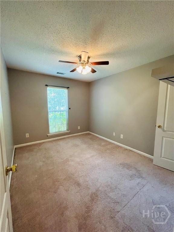 152 Junco Way, Savannah, GA 31419 - unfurnished room with a ceiling fan, carpet flooring, a textured ceiling, and baseboards