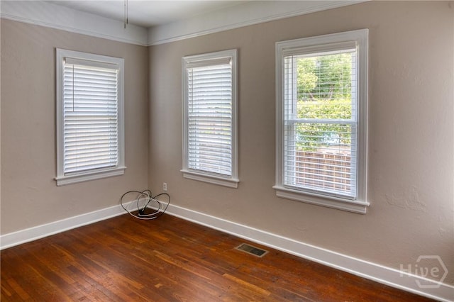 126 E 53rd St, Savannah, GA 31405 - unfurnished room with baseboards and dark wood-style flooring