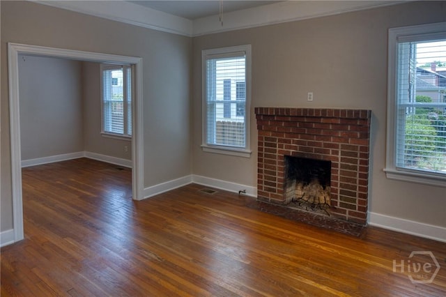 126 E 53rd St, Savannah, GA 31405 - unfurnished living room with wood finished floors, baseboards, and a fireplace