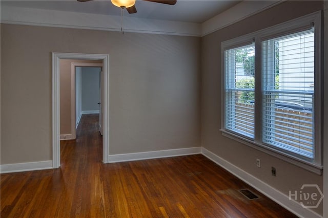 126 E 53rd St, Savannah, GA 31405 - empty room featuring a ceiling fan, dark wood-type flooring, and baseboards
