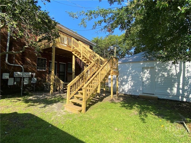 126 E 53rd St, Savannah, GA 31405 - rear view of property with a yard, stairway, an outdoor structure, and a deck