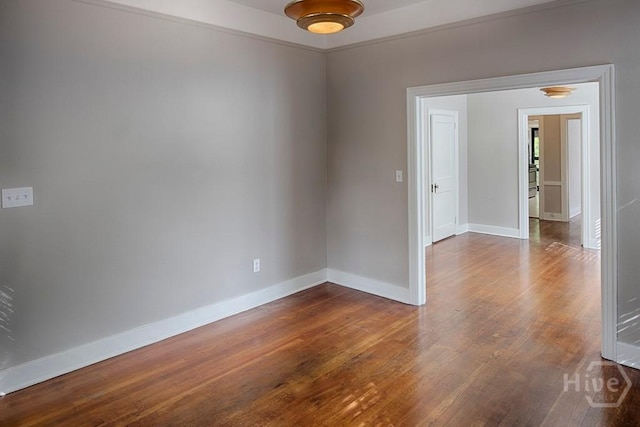 126 E 53rd St, Savannah, GA 31405 - empty room with wood finished floors and baseboards