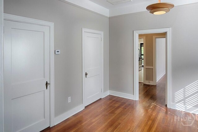 126 E 53rd St, Savannah, GA 31405 - empty room featuring wood finished floors and baseboards
