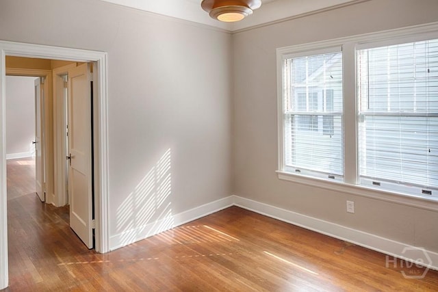 126 E 53rd St, Savannah, GA 31405 - empty room featuring baseboards and wood finished floors