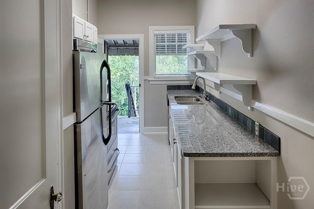 126 E 53rd St, Savannah, GA 31405 - kitchen featuring a sink, open shelves, freestanding refrigerator, white cabinets, and light tile patterned floors