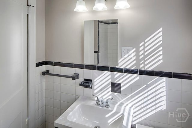 126 E 53rd St, Savannah, GA 31405 - bathroom featuring a sink and tile walls