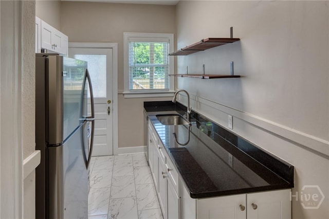126 E 53rd St, Savannah, GA 31405 - kitchen featuring freestanding refrigerator, a sink, open shelves, light marble finish floors, and white cabinetry