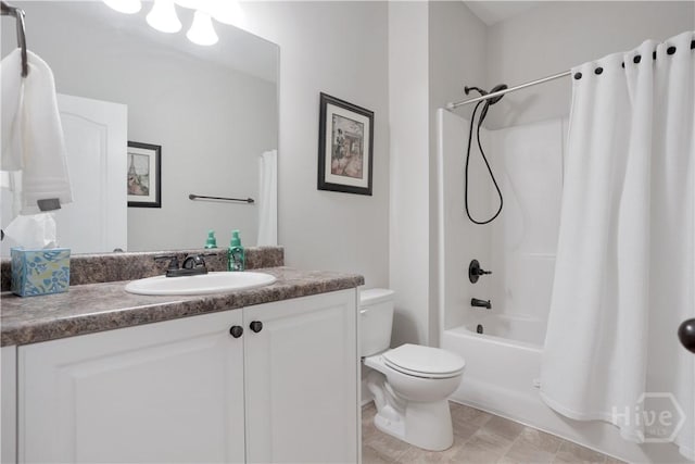 full bath featuring shower / bath combo, toilet, and vanity