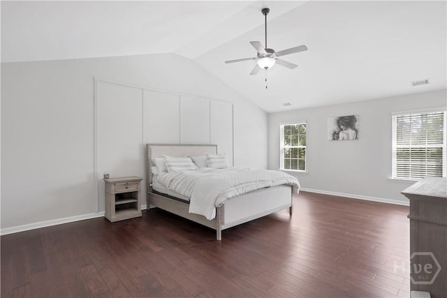 bedroom featuring vaulted ceiling, dark wood finished floors, ceiling fan, and baseboards