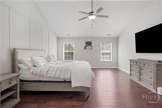 bedroom with vaulted ceiling, dark wood-style floors, baseboards, and ceiling fan