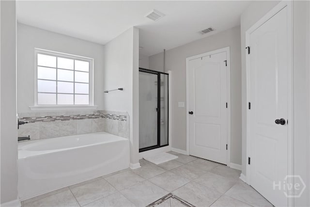 full bath with a garden tub, a shower stall, and baseboards