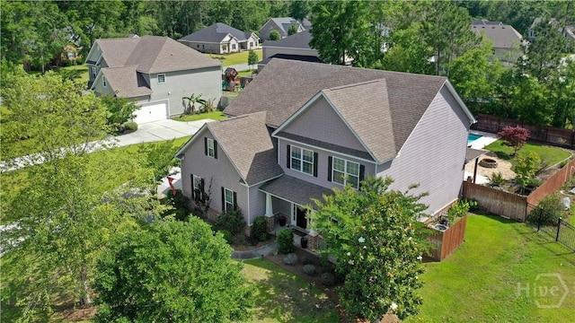 aerial perspective of suburban area with a tree filled landscape