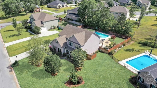 aerial view of residential area featuring a pool area