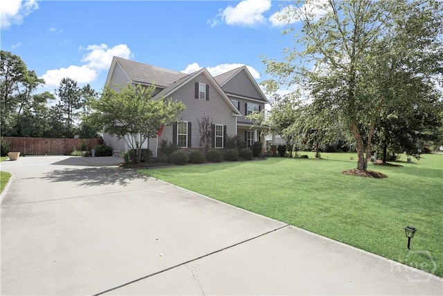 view of side of home featuring concrete driveway