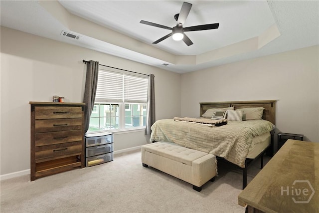 306 Madison Oaks Dr, Rincon, GA 31326 - bedroom featuring baseboards, light carpet, a raised ceiling, and a ceiling fan
