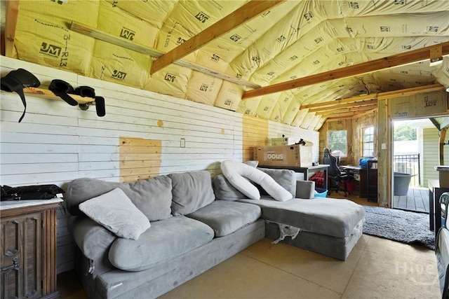306 Madison Oaks Dr, Rincon, GA 31326 - living room featuring vaulted ceiling, wood walls, and concrete flooring