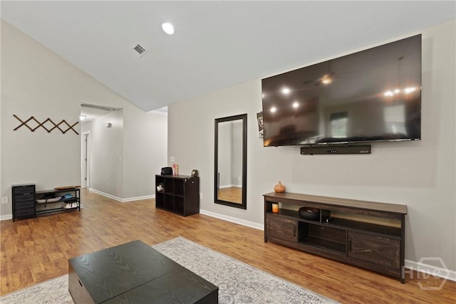 306 Madison Oaks Dr, Rincon, GA 31326 - living room featuring wood finished floors, baseboards, and lofted ceiling