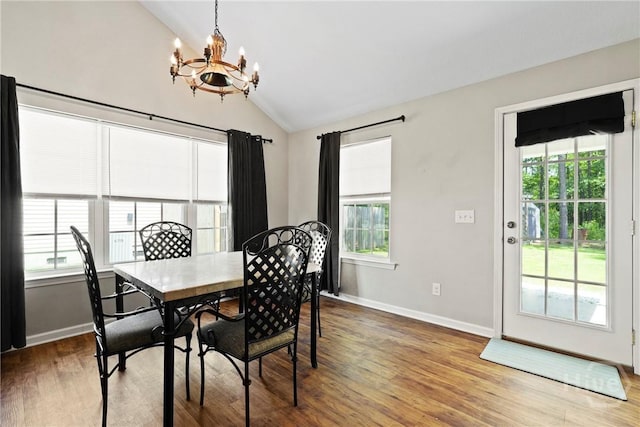 306 Madison Oaks Dr, Rincon, GA 31326 - dining space featuring a chandelier, lofted ceiling, plenty of natural light, wood finished floors, and baseboards