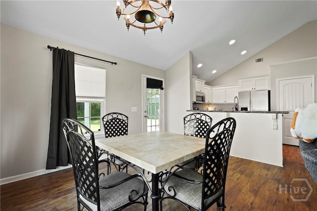 306 Madison Oaks Dr, Rincon, GA 31326 - dining room with a chandelier, recessed lighting, dark wood finished floors, and lofted ceiling