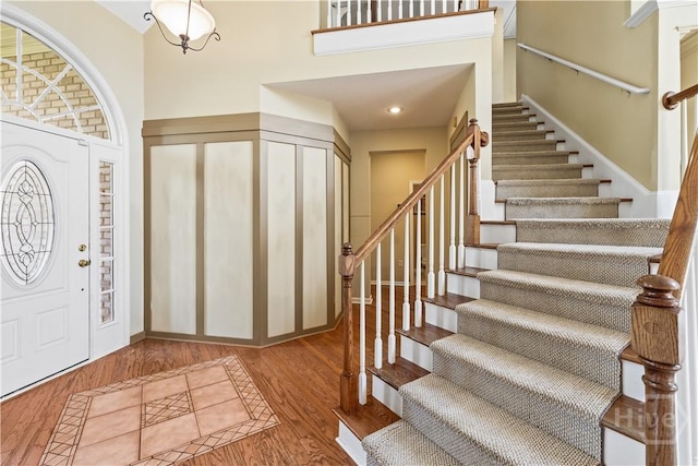 303 Stonebridge Cir, Savannah, GA 31419 - foyer entrance with stairs, a high ceiling, and wood finished floors