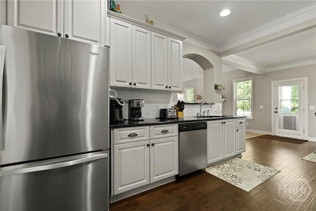 119 Greystone Dr, Guyton, GA 31312 - kitchen with appliances with stainless steel finishes, a sink, dark countertops, tasteful backsplash, and dark wood-style floors