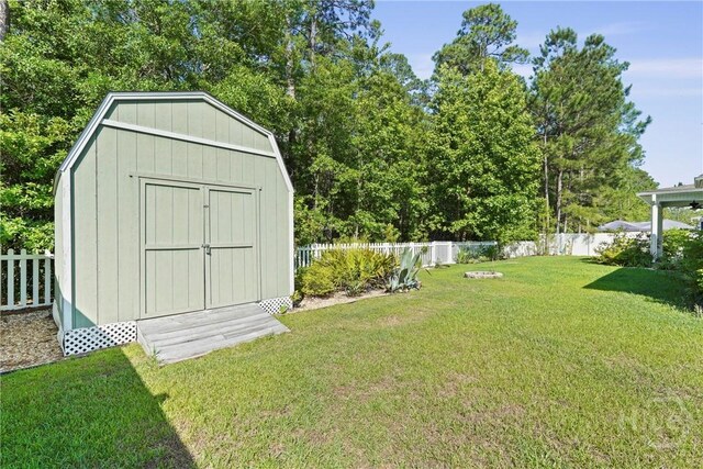 119 Greystone Dr, Guyton, GA 31312 - view of yard featuring a storage unit and an outbuilding