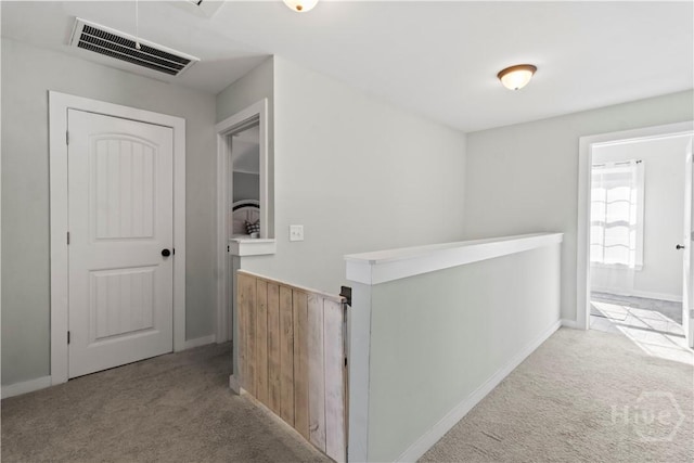 216 Cypress Lakes Dr, Bloomingdale, GA 31302 - hallway featuring light carpet, an upstairs landing, and baseboards