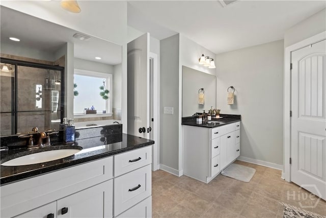216 Cypress Lakes Dr, Bloomingdale, GA 31302 - full bath with a stall shower, two vanities, and baseboards