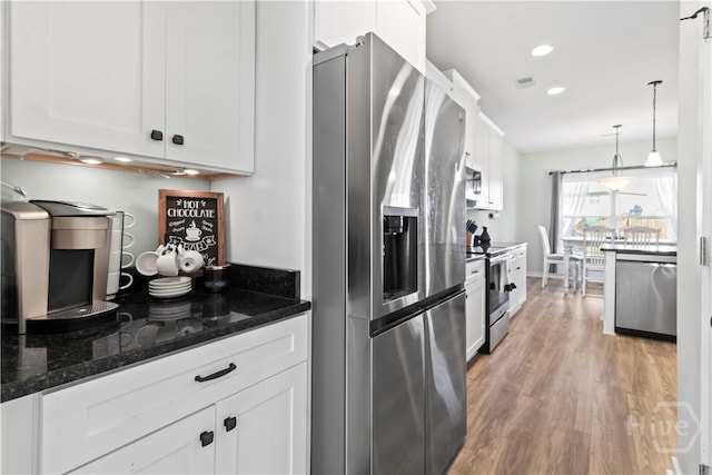 216 Cypress Lakes Dr, Bloomingdale, GA 31302 - kitchen featuring stainless steel appliances, white cabinetry, light wood finished floors, and recessed lighting
