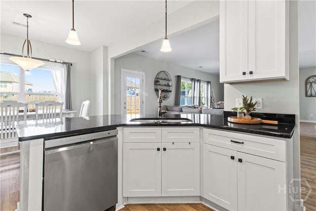 216 Cypress Lakes Dr, Bloomingdale, GA 31302 - kitchen with stainless steel dishwasher, a sink, light wood-style flooring, and white cabinets