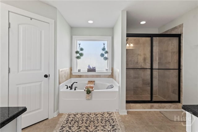 216 Cypress Lakes Dr, Bloomingdale, GA 31302 - bathroom with a stall shower, a garden tub, tile patterned floors, vanity, and recessed lighting
