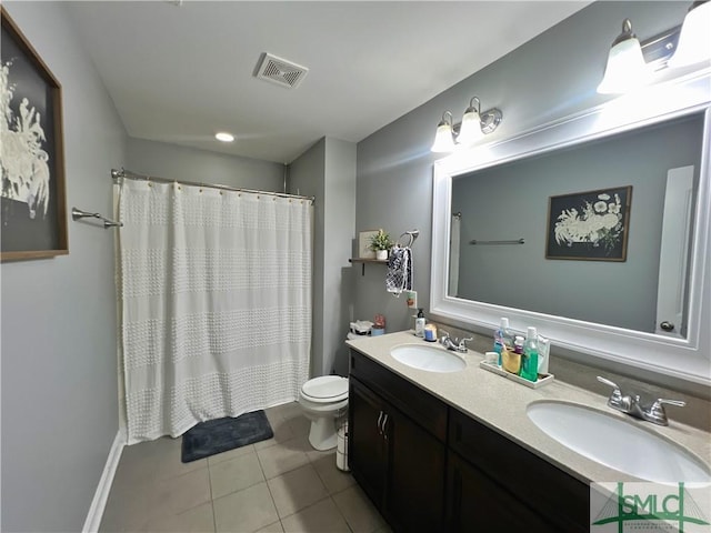 98 Vickers Rd SE, Ludowici, GA 31316 - full bath with tile patterned flooring, double vanity, toilet, baseboards, and a shower with shower curtain