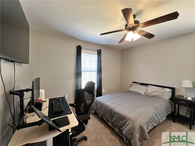 98 Vickers Rd SE, Ludowici, GA 31316 - bedroom with light carpet, a ceiling fan, and an office area