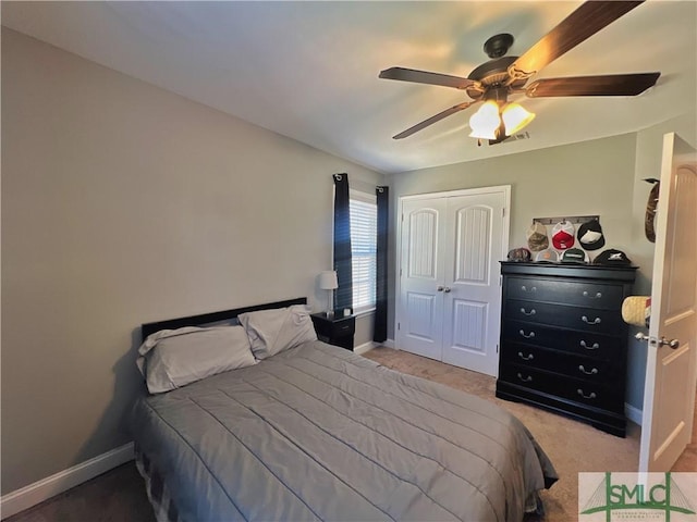 98 Vickers Rd SE, Ludowici, GA 31316 - bedroom with a closet, carpet floors, baseboards, and ceiling fan