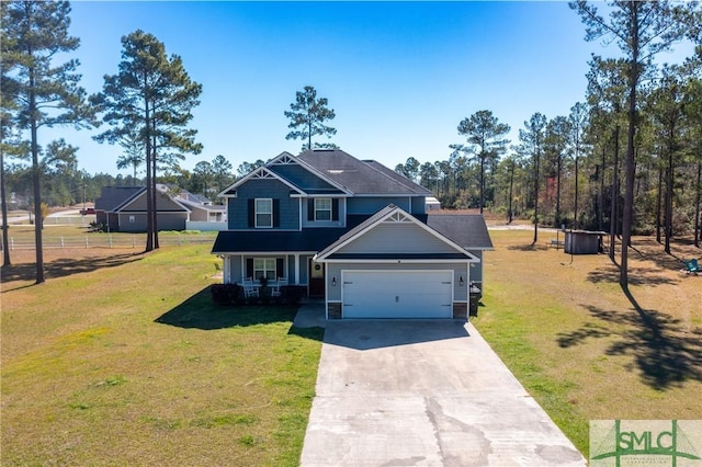 98 Vickers Rd SE, Ludowici, GA 31316 - craftsman inspired home with a garage, driveway, covered porch, and a front yard