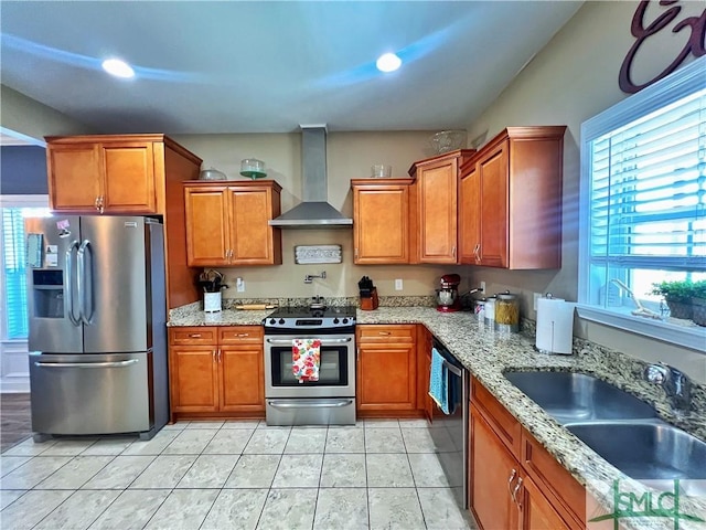 98 Vickers Rd SE, Ludowici, GA 31316 - kitchen featuring stainless steel appliances, wall chimney exhaust hood, brown cabinets, and recessed lighting