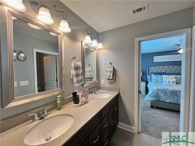 98 Vickers Rd SE, Ludowici, GA 31316 - ensuite bathroom featuring double vanity, tile patterned flooring, and baseboards