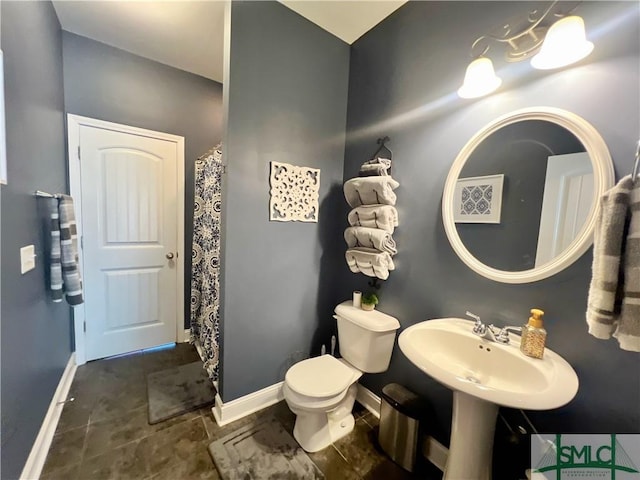 98 Vickers Rd SE, Ludowici, GA 31316 - bathroom featuring toilet and baseboards