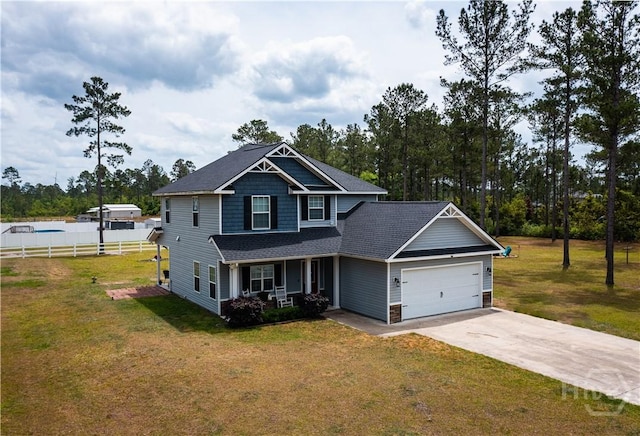 98 Vickers Rd SE, Ludowici, GA 31316 - craftsman house with covered porch, a garage, concrete driveway, and a shingled roof