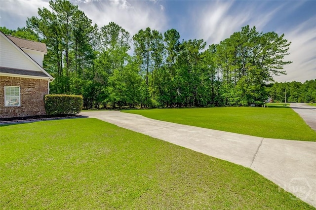 2 N Camellia Ct, Guyton, GA 31312 - view of grassy yard featuring view of wooded area