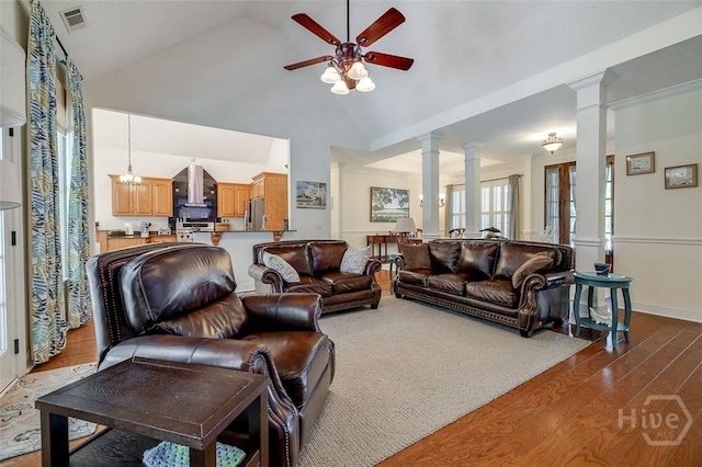 2 N Camellia Ct, Guyton, GA 31312 - living area with ornate columns, dark wood-type flooring, ceiling fan, and high vaulted ceiling