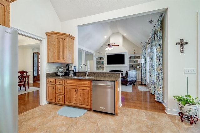 2 N Camellia Ct, Guyton, GA 31312 - kitchen with appliances with stainless steel finishes, a sink, a ceiling fan, a fireplace, and open floor plan