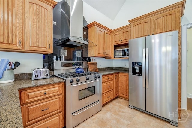 2 N Camellia Ct, Guyton, GA 31312 - kitchen featuring appliances with stainless steel finishes, wall chimney exhaust hood, lofted ceiling, dark stone countertops, and light tile patterned flooring