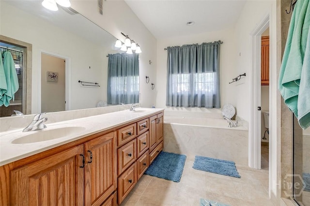 2 N Camellia Ct, Guyton, GA 31312 - bathroom featuring a garden tub, tile patterned flooring, double vanity, and toilet
