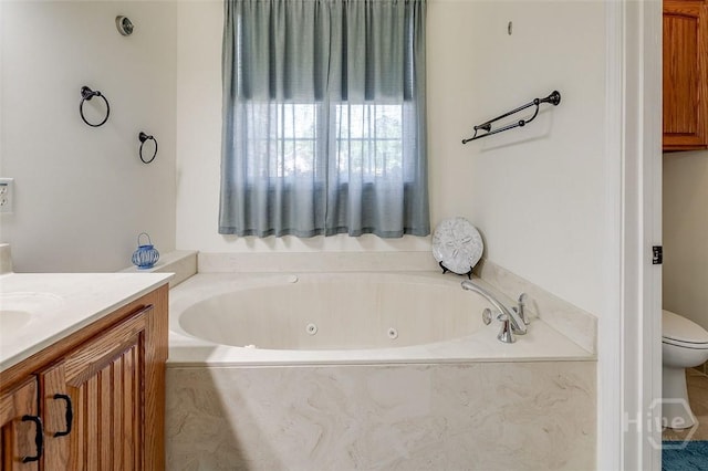 2 N Camellia Ct, Guyton, GA 31312 - bathroom featuring a tub with jets, vanity, and toilet