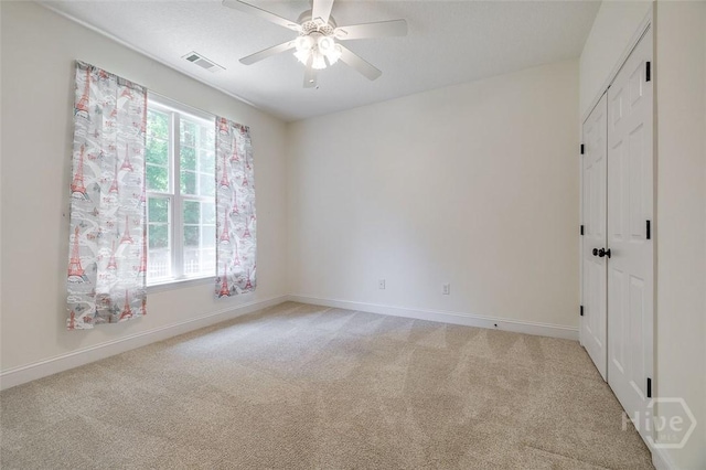 2 N Camellia Ct, Guyton, GA 31312 - unfurnished bedroom featuring light colored carpet, baseboards, a ceiling fan, and a closet