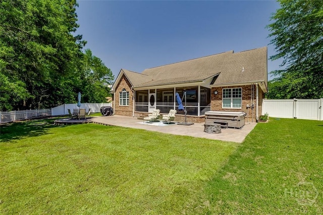 2 N Camellia Ct, Guyton, GA 31312 - rear view of property with a patio area, a sunroom, brick siding, and a gate