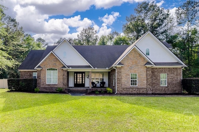 2 N Camellia Ct, Guyton, GA 31312 - view of front of home with a front lawn, a porch, and brick siding