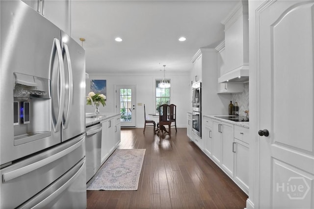 447 Walthour Dr, Rincon, GA 31326 - kitchen with stainless steel appliances, ornamental molding, recessed lighting, white cabinetry, and dark wood-style flooring