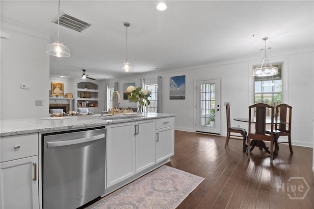 447 Walthour Dr, Rincon, GA 31326 - kitchen with stainless steel dishwasher, a sink, white cabinets, crown molding, and open floor plan
